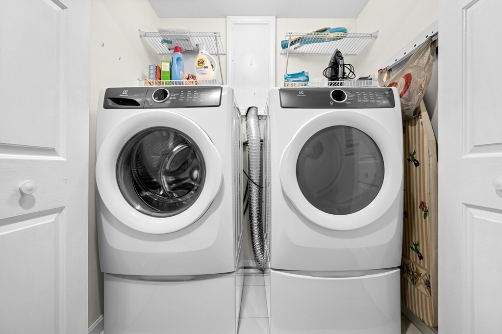 151 Stone Ridge Road, Unit 151 Franklin, MA 02038 - Photo 27 of 39 a utility room with dryer and washer