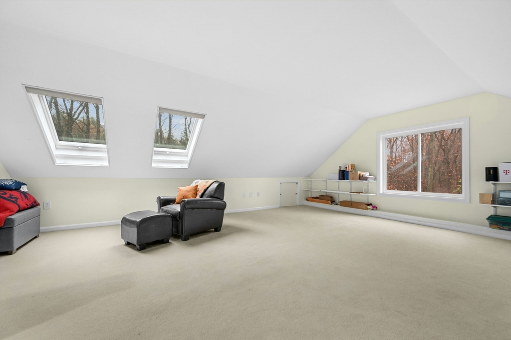 151 Stone Ridge Road, Unit 151 Franklin, MA 02038 - Photo 30 of 39 a living room with furniture and a window