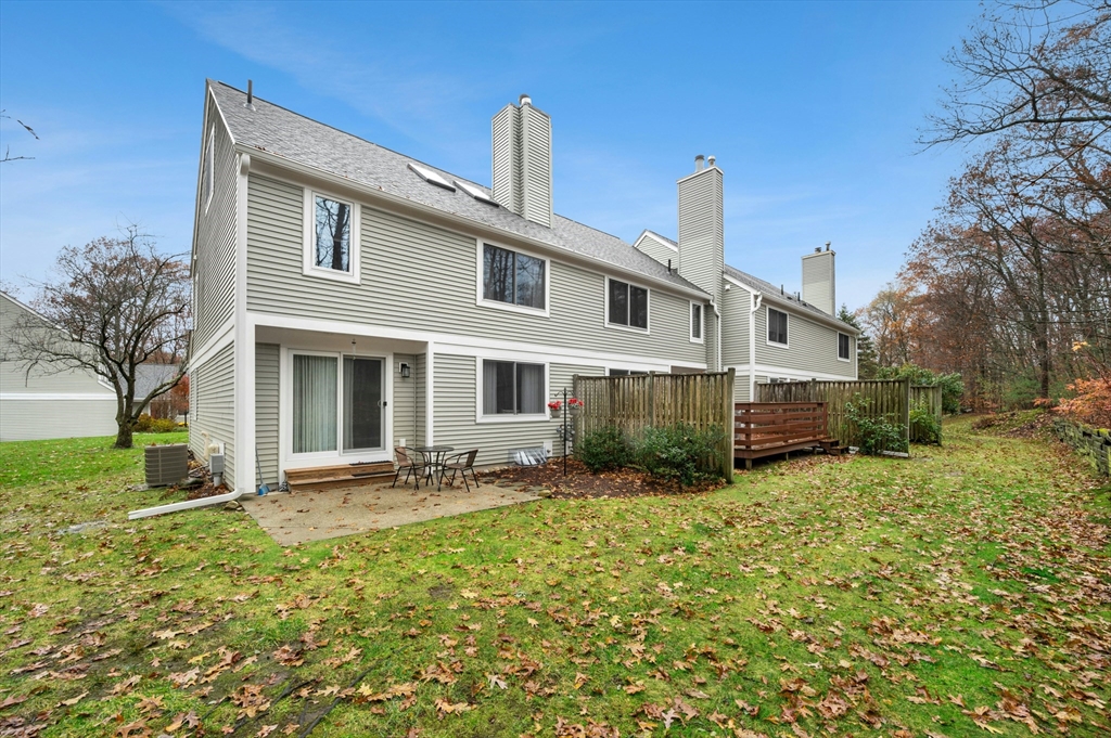151 Stone Ridge Road, Unit 151 Franklin, MA 02038 - Photo 36 of 39 a front view of a house with a yard