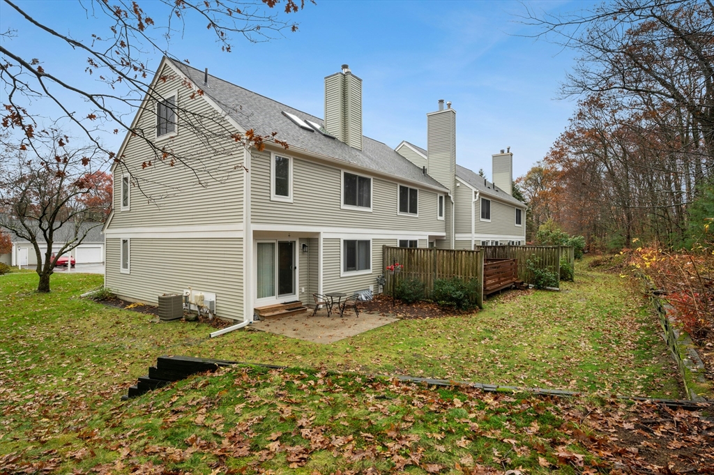 151 Stone Ridge Road, Unit 151 Franklin, MA 02038 - Photo 37 of 39 a view of a house with a yard