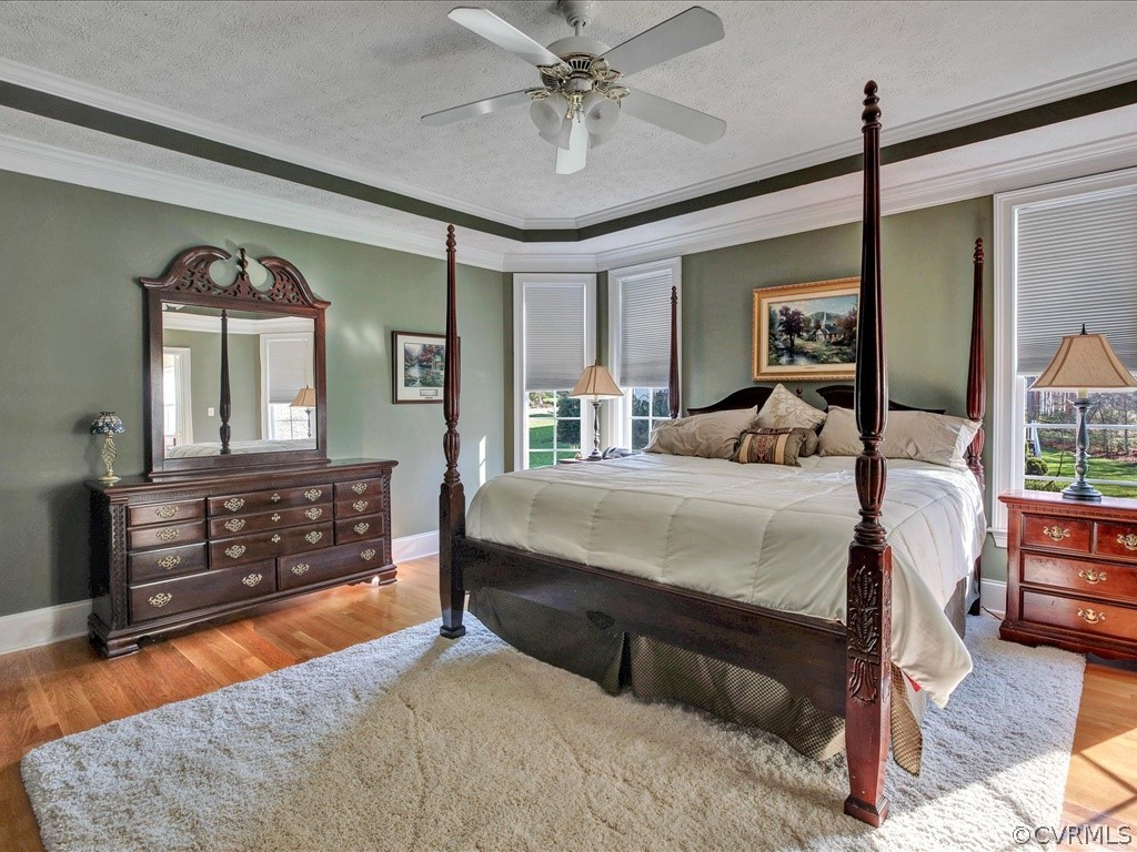 13711 Beechwood Point Road Midlothian, VA 23112 - Photo 18 of 49 a bedroom with a bed and wooden floor
