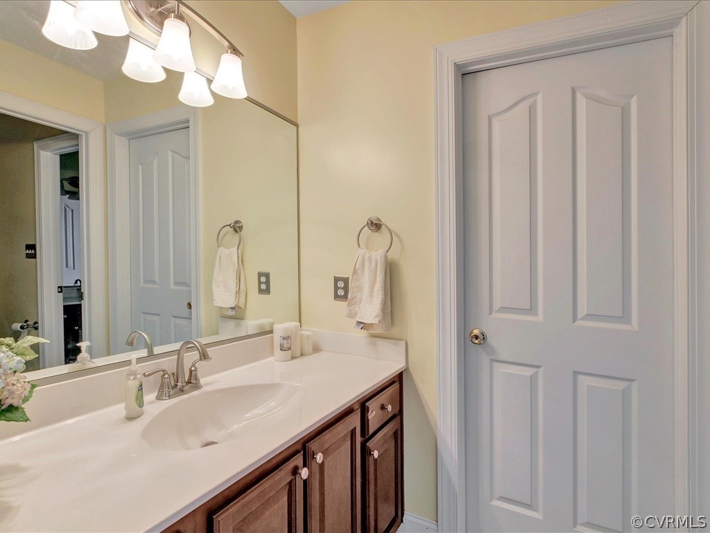 13711 Beechwood Point Road Midlothian, VA 23112 - Photo 24 of 49 a bathroom with a sink vanity and a mirror
