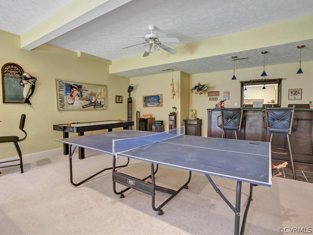 13711 Beechwood Point Road Midlothian, VA 23112 - Photo 33 of 49 a living room with furniture a rug and a chandelier