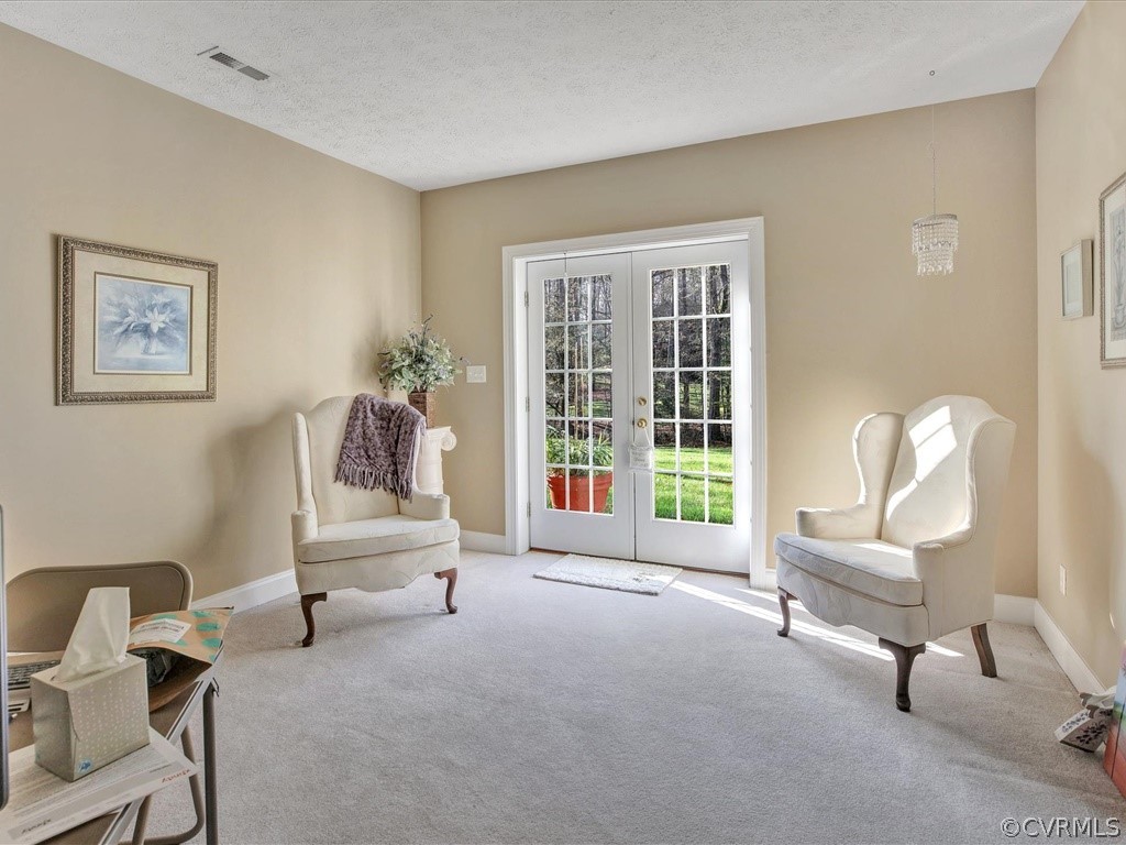 13711 Beechwood Point Road Midlothian, VA 23112 - Photo 36 of 49 a living room with furniture and a large window