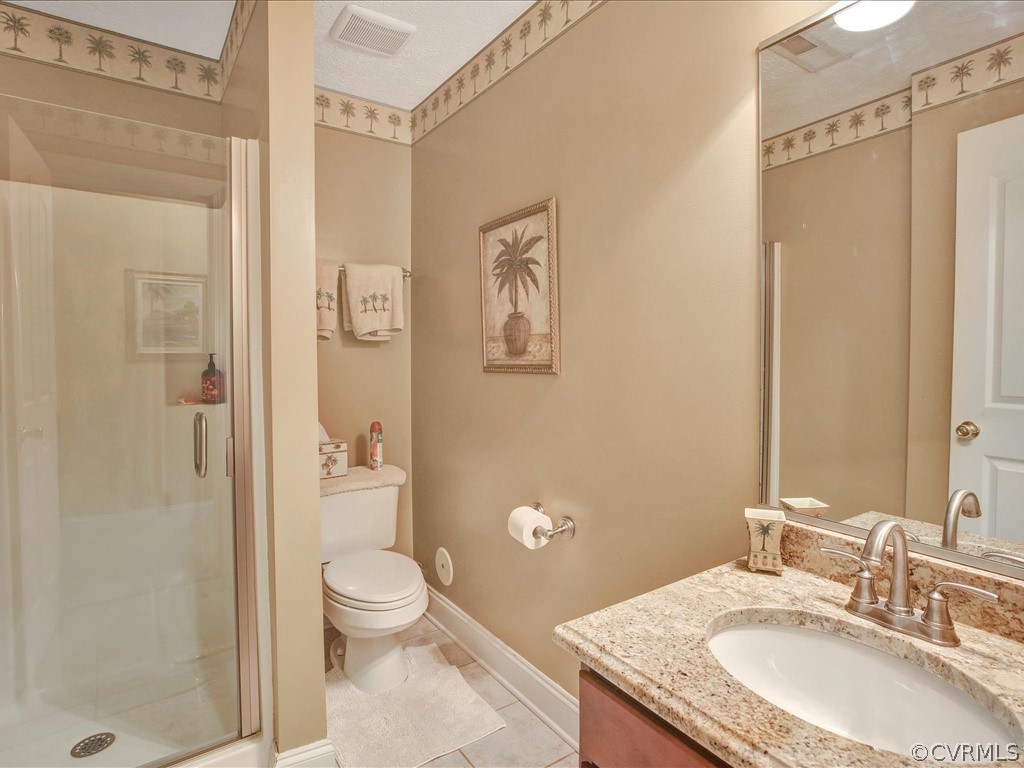 13711 Beechwood Point Road Midlothian, VA 23112 - Photo 37 of 49 a bathroom with a granite countertop toilet a sink and a mirror