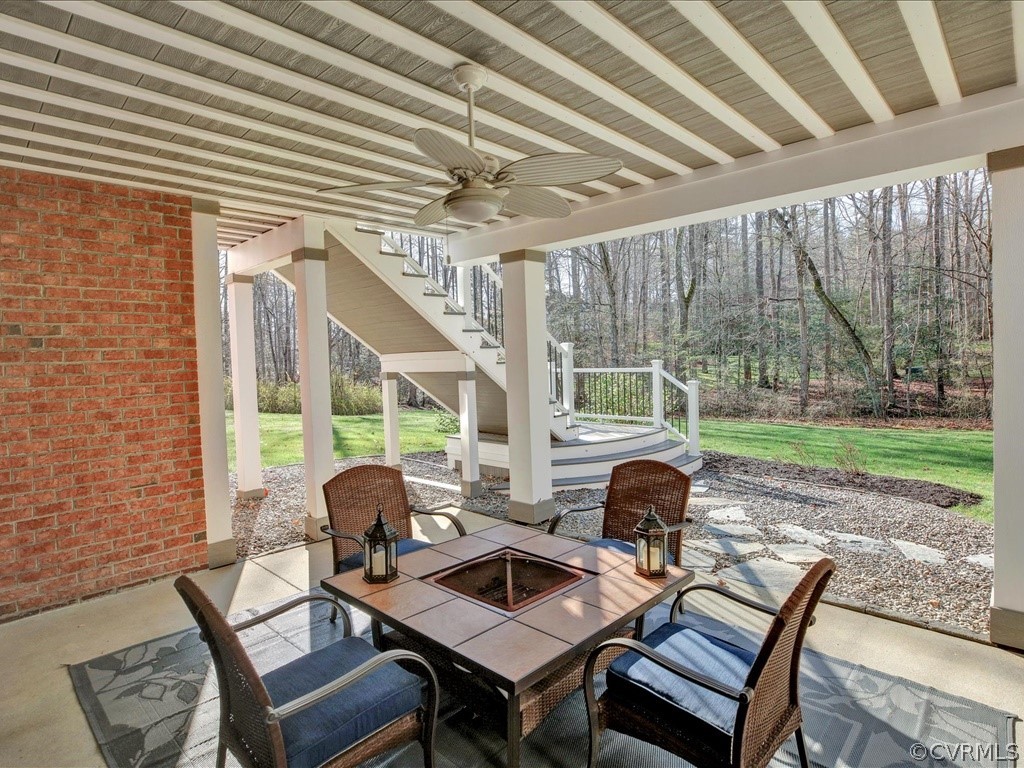 13711 Beechwood Point Road Midlothian, VA 23112 - Photo 40 of 49 a view of a patio with a table and chairs