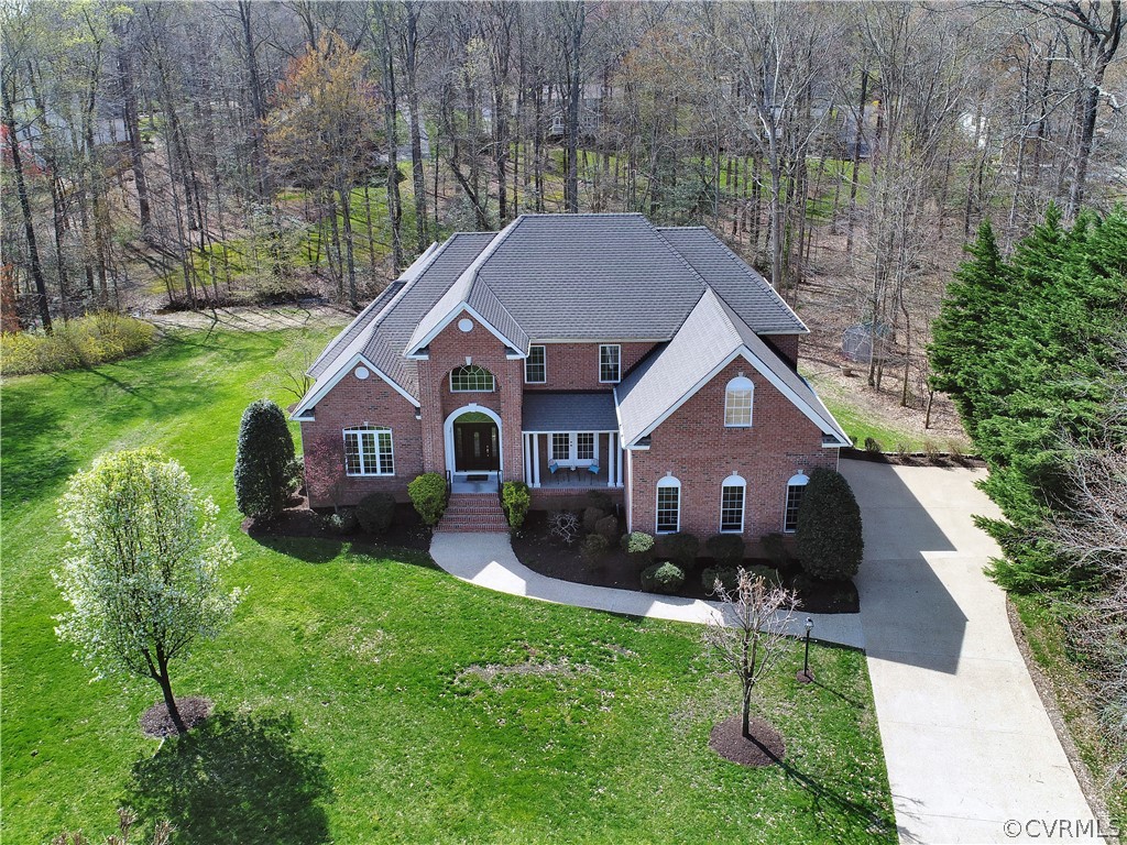 13711 Beechwood Point Road Midlothian, VA 23112 - Photo 49 of 49 a front view of a house with a yard and garage