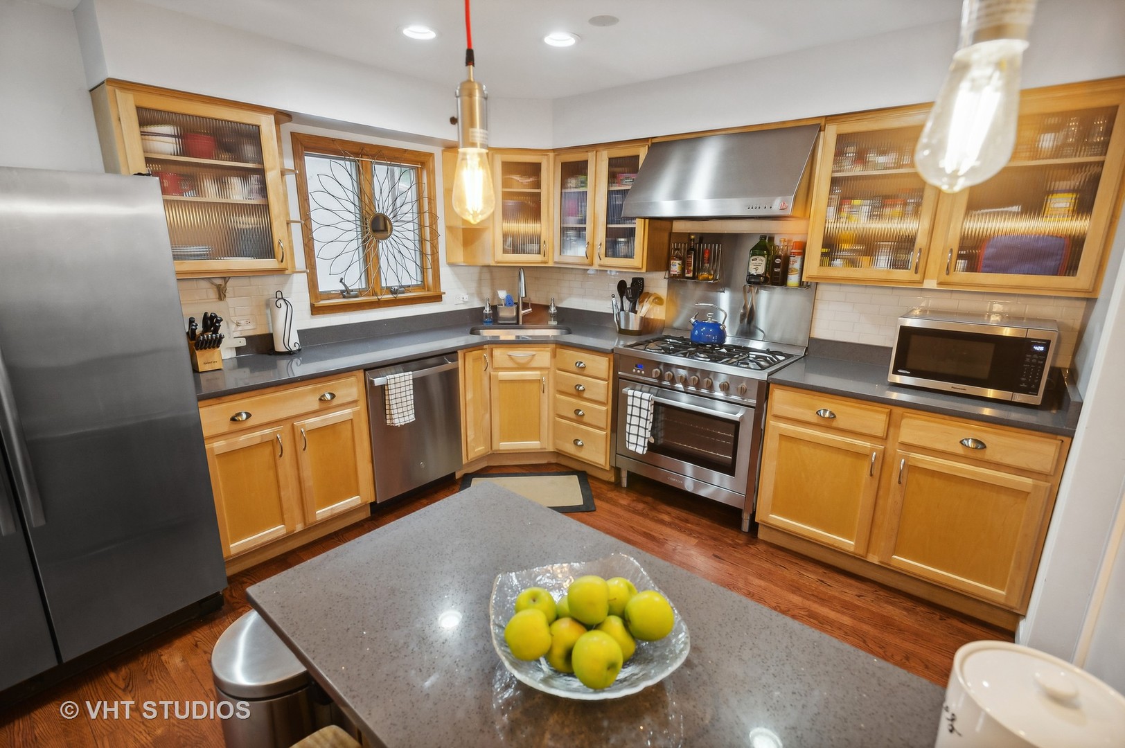 1300 West Talcott Road Park Ridge, IL 60068 - Photo 6 of 16 a kitchen with stainless steel appliances granite countertop wooden cabinets a stove a sink and a refrigerator
