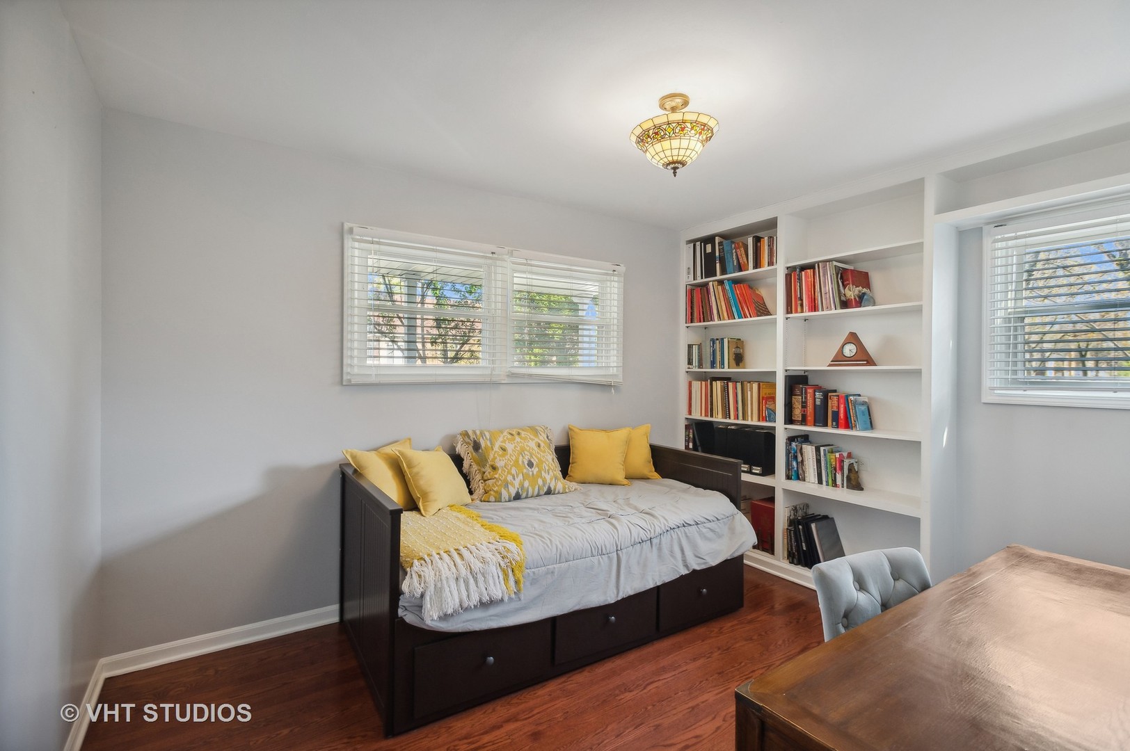 1300 West Talcott Road Park Ridge, IL 60068 - Photo 7 of 16 a bedroom with furniture and a book shelf