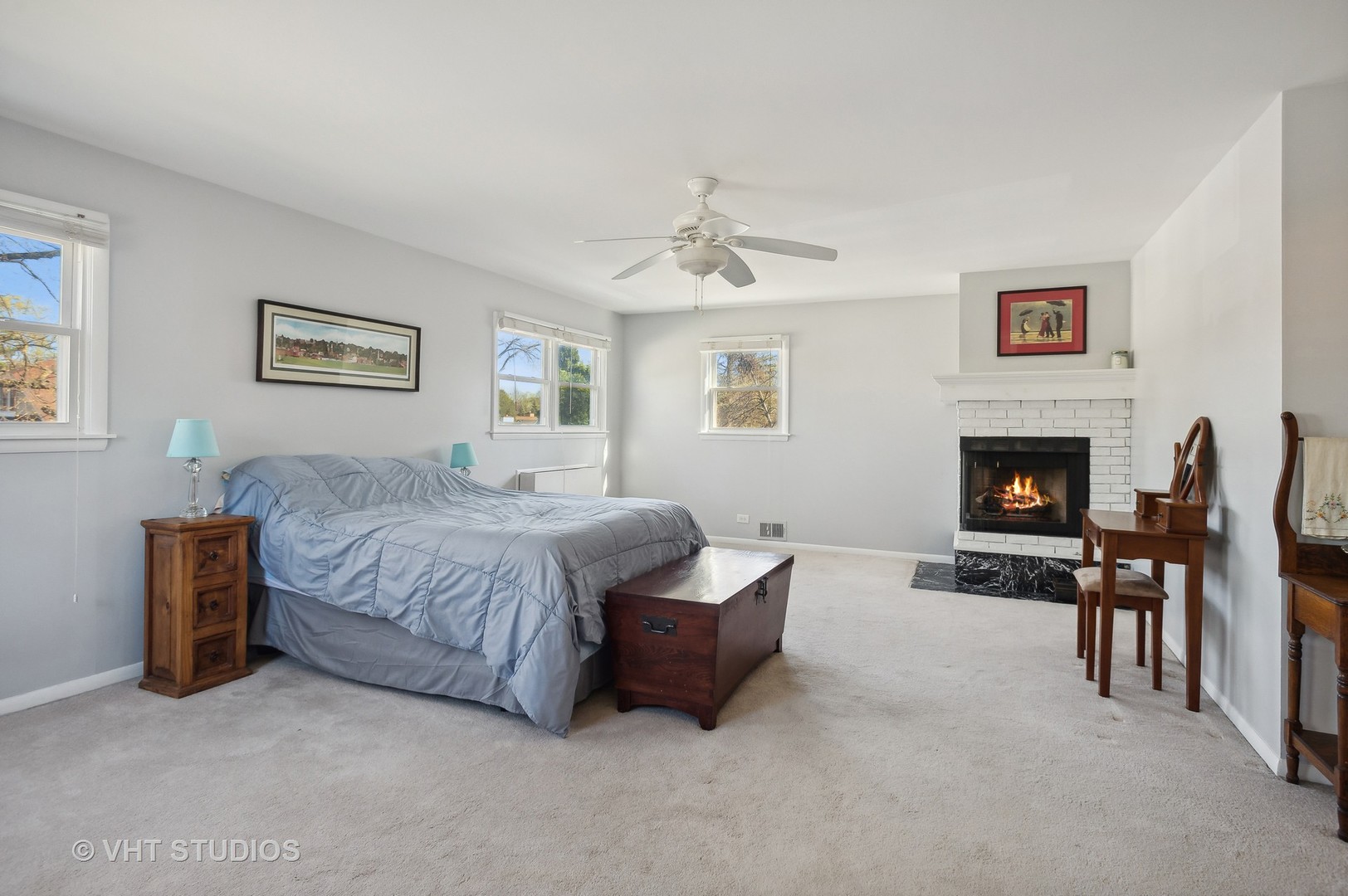 1300 West Talcott Road Park Ridge, IL 60068 - Photo 10 of 16 a spacious bedroom with a bed and a fireplace