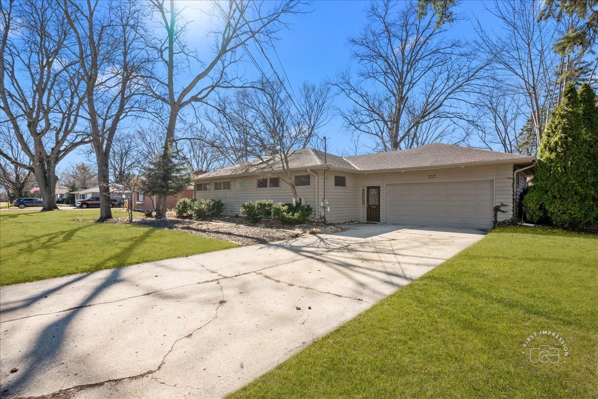 337 Republic Road Batavia, IL 60510 - Photo 2 of 22 a front view of house with yard and green space