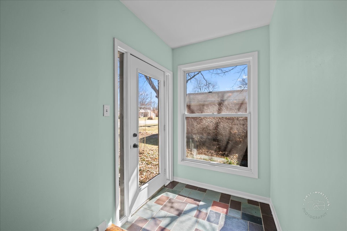 337 Republic Road Batavia, IL 60510 - Photo 3 of 22 a view of a hallway with a glass door and glass door
