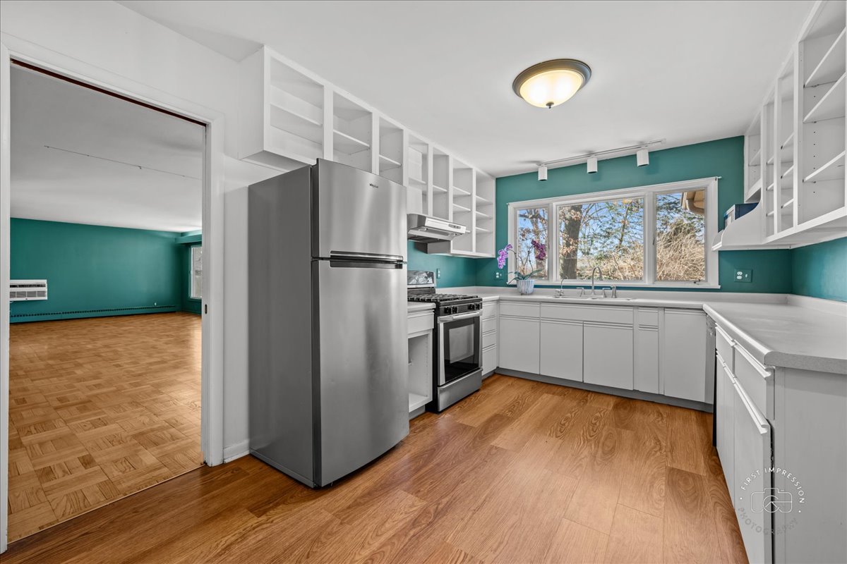 337 Republic Road Batavia, IL 60510 - Photo 4 of 22 a kitchen with a refrigerator and a sink