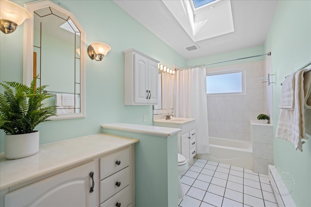 337 Republic Road Batavia, IL 60510 - Photo 10 of 22 a spacious bathroom with a sink a mirror and a shower