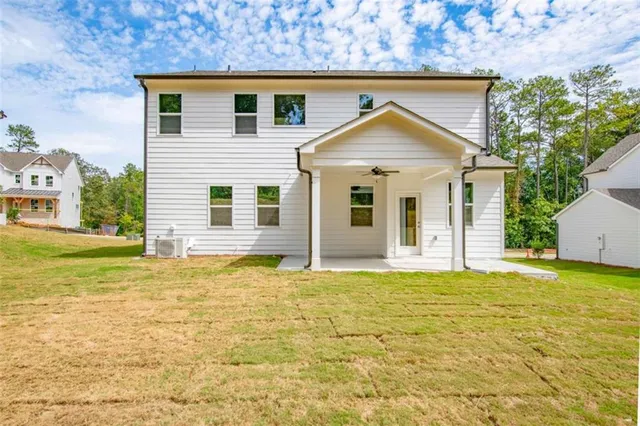 a view of a house with a yard