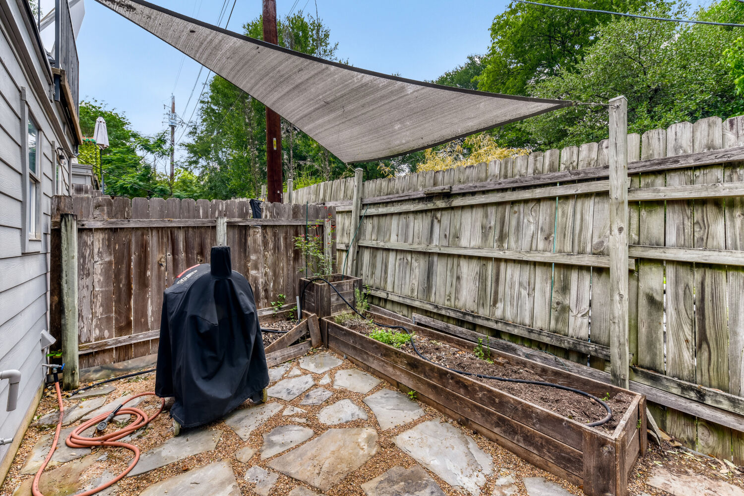 1912 Lightsey Road, Unit 6 Austin, TX 78704 - Photo 23 of 27 a view of a wooden deck and a backyard