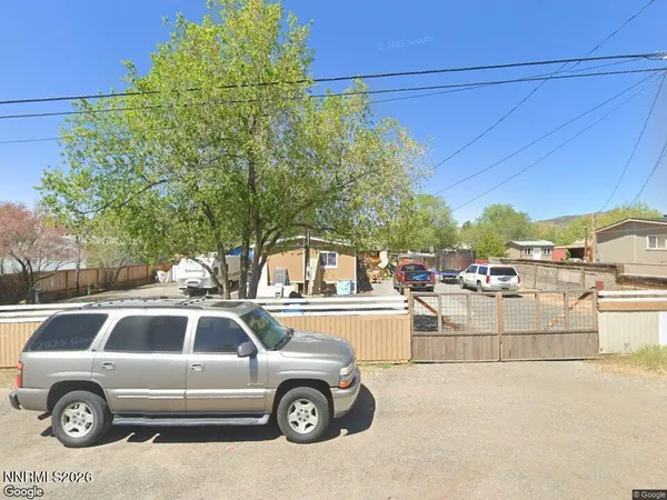 a view of a cars park in front of house