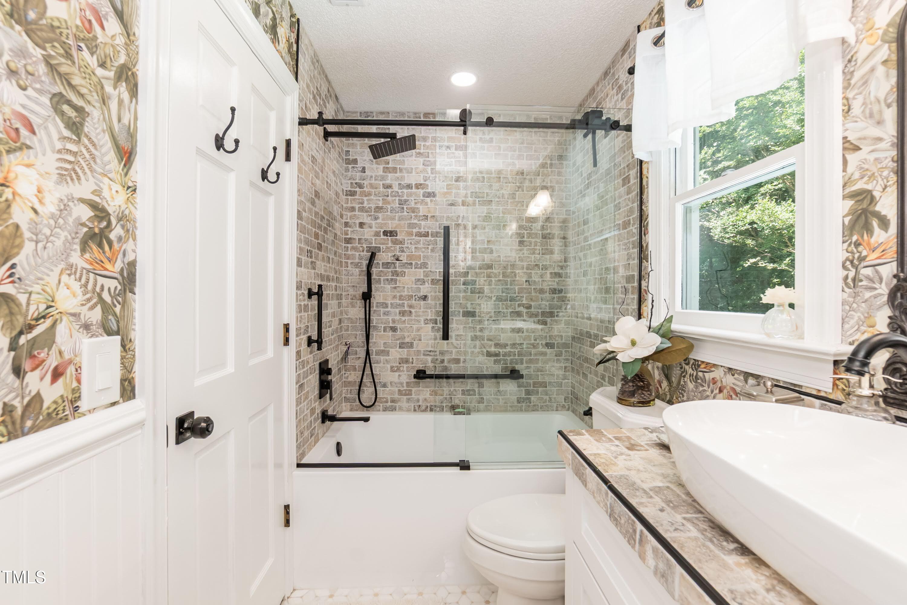 7216 Rabbit Run Wake Forest, NC 27587 - Photo 33 of 75 a bathroom with a granite countertop sink mirror vanity and toilet
