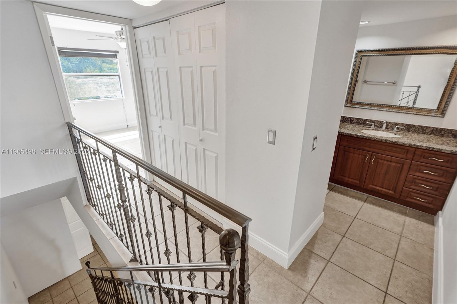4600 Southwest 67th Avenue, Unit 245 Miami, FL 33155 - Photo 18 of 51 Stairs, 2nd floor landing, and entire 2nd floor has matching neutral tiles just as the 1st floor does.