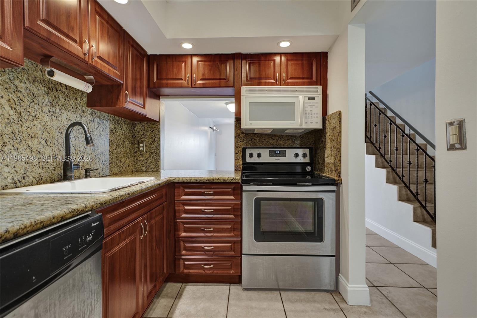 4600 Southwest 67th Avenue, Unit 245 Miami, FL 33155 - Photo 5 of 51 Note the convenient pass-through to the dining room.