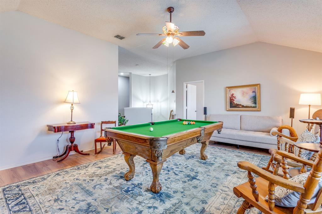 4816 Sleepy Ridge Circle Fort Worth, TX 76133 - Photo 20 of 36 Game room featuring wood finished floors, a textured ceiling, pool table, and a ceiling fan
