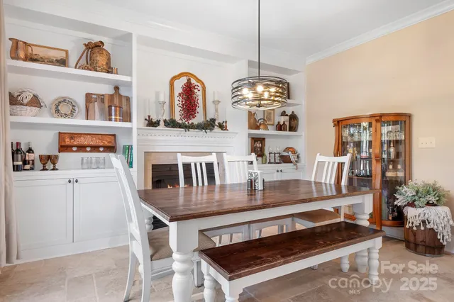 a dining room with furniture and chandelier