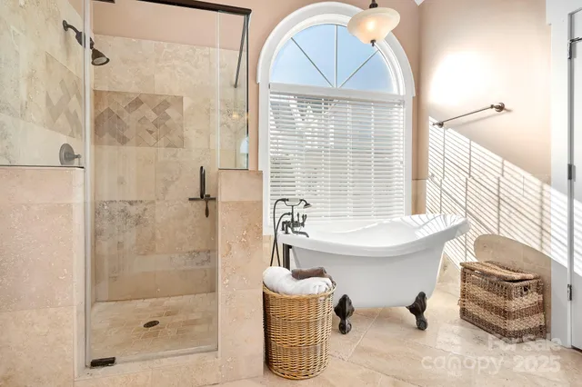 a bathroom with a sink a bathtub and shower