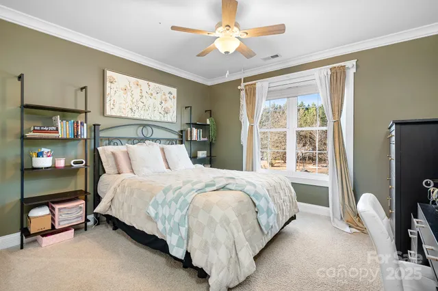 a bedroom with a bed and a table in it