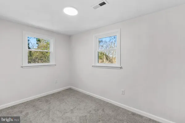 a bathroom with a toilet and shower