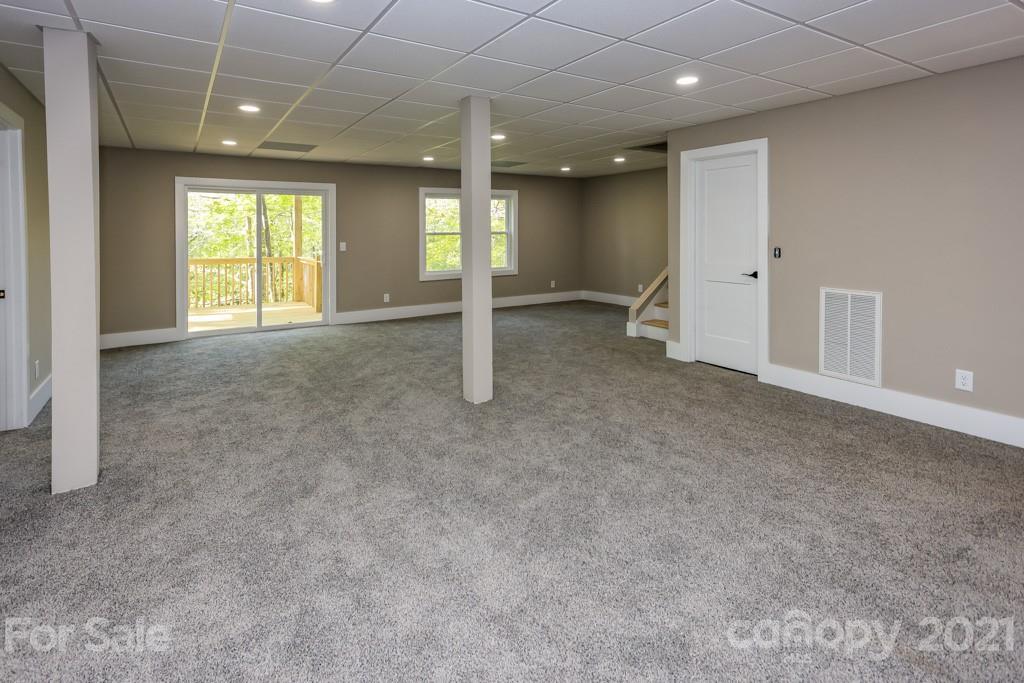 223 Hidden Hill Road Tryon, NC 28782 - Photo 22 of 27 a view of an empty room with a window