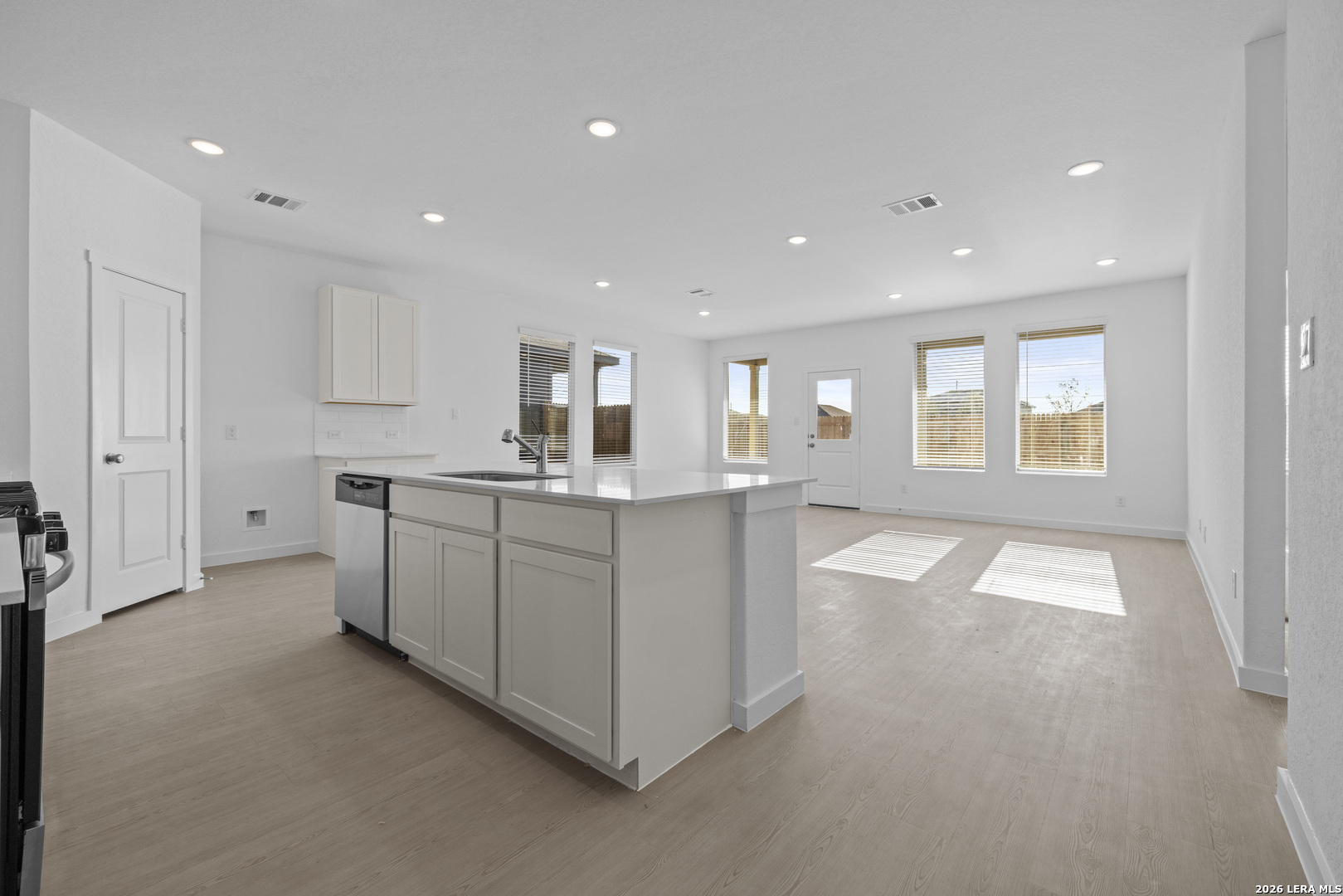 1895 Nuthatch Ridge New Braunfels, TX 78130 - Photo 3 of 20 a large white kitchen with a large window