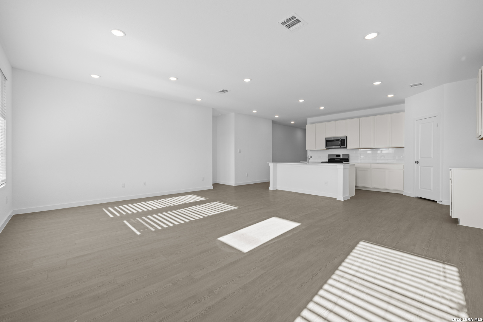 1895 Nuthatch Ridge New Braunfels, TX 78130 - Photo 6 of 20 a view of kitchen with refrigerator and white cabinets