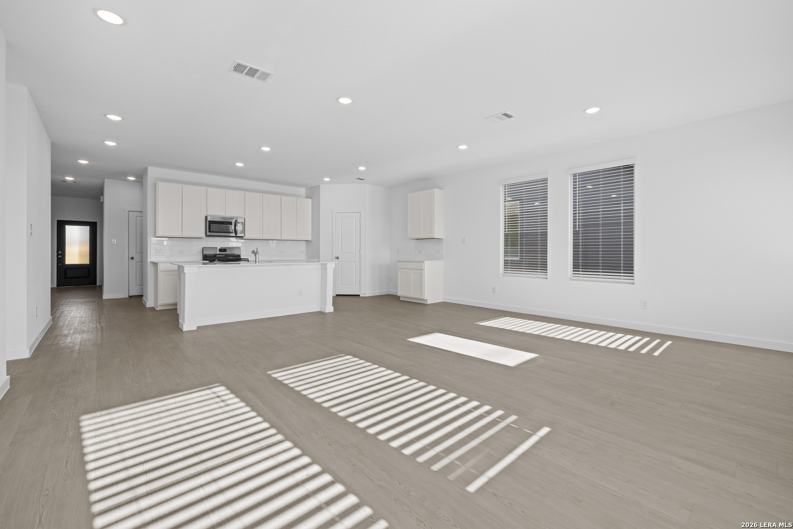 1895 Nuthatch Ridge New Braunfels, TX 78130 - Photo 7 of 20 a view of a kitchen with a sink and a refrigerator