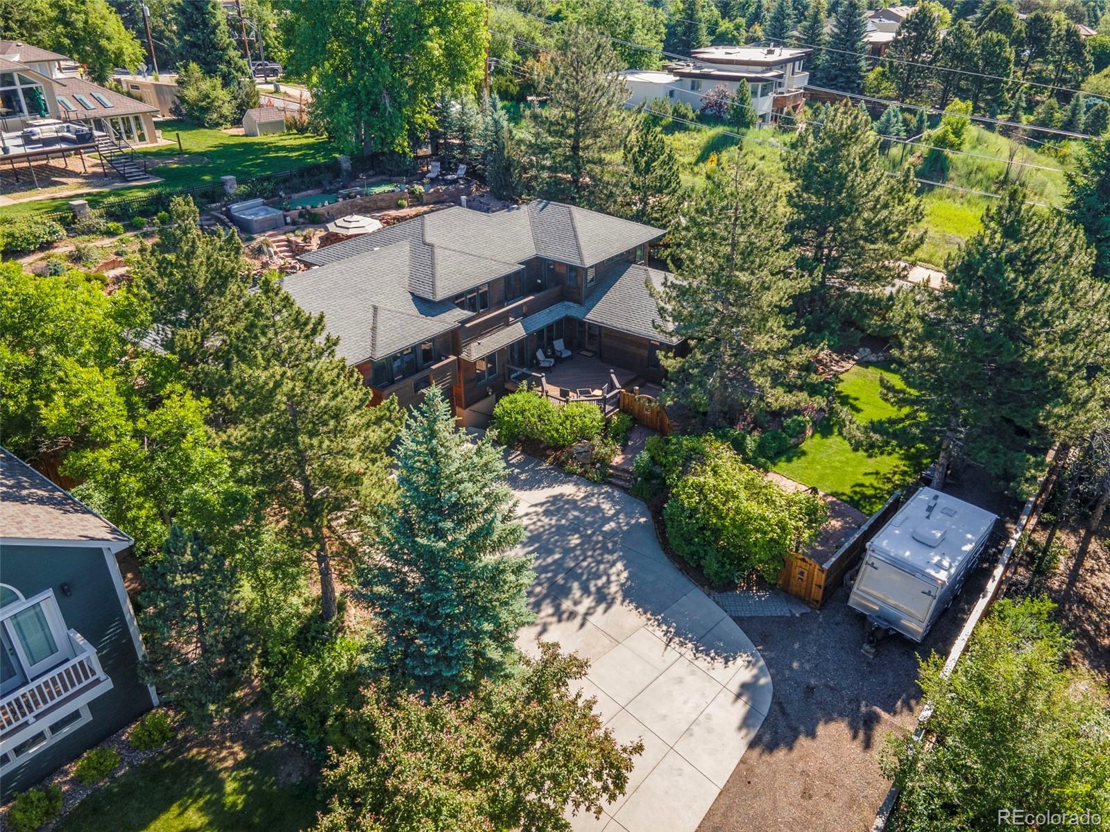 an aerial view of a house with a yard and garden