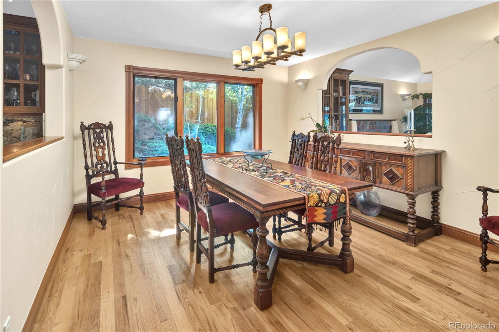 3816 Cloverleaf Drive Boulder, CO 80304 - Photo 12 of 35 a view of a dining room with furniture a chandelier and wooden floor