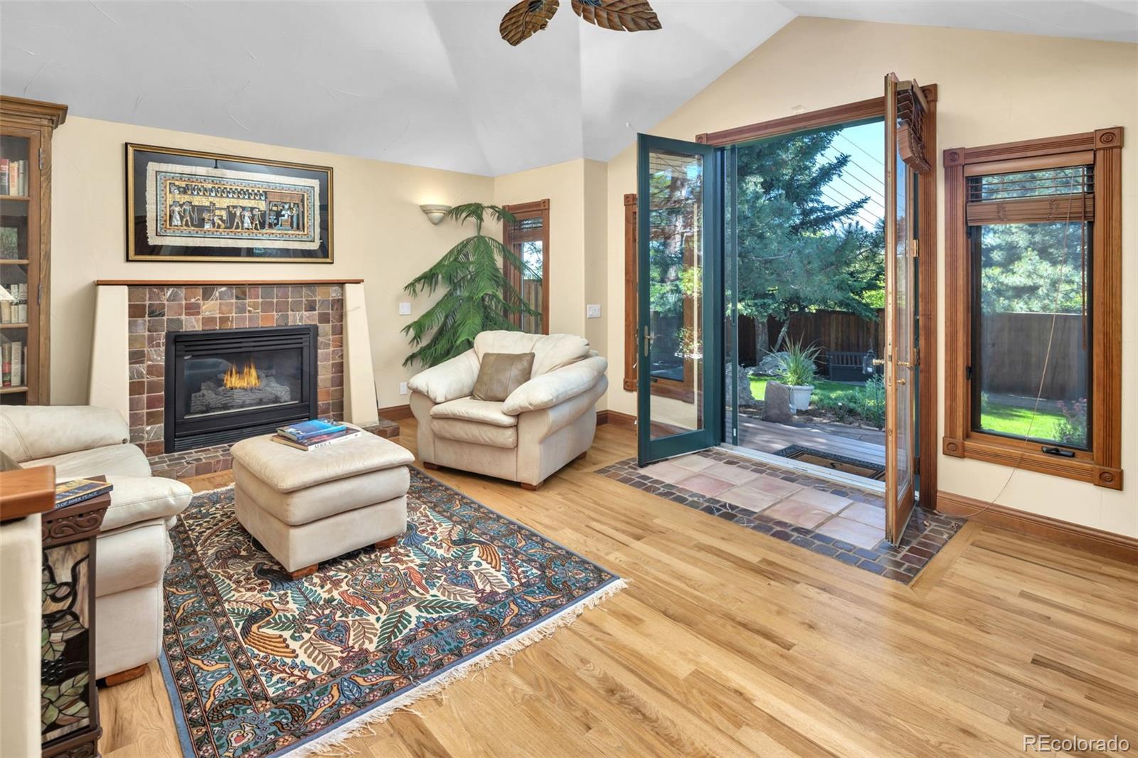 3816 Cloverleaf Drive Boulder, CO 80304 - Photo 14 of 35 a living room with furniture large window and a fireplace