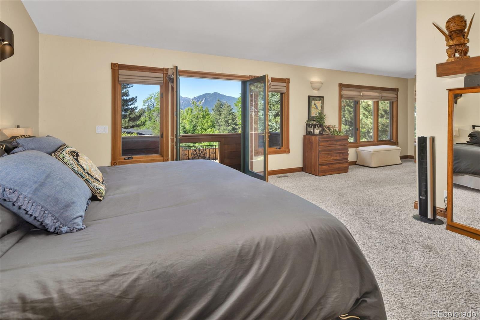 3816 Cloverleaf Drive Boulder, CO 80304 - Photo 18 of 35 a spacious bedroom with a large bed and a large window