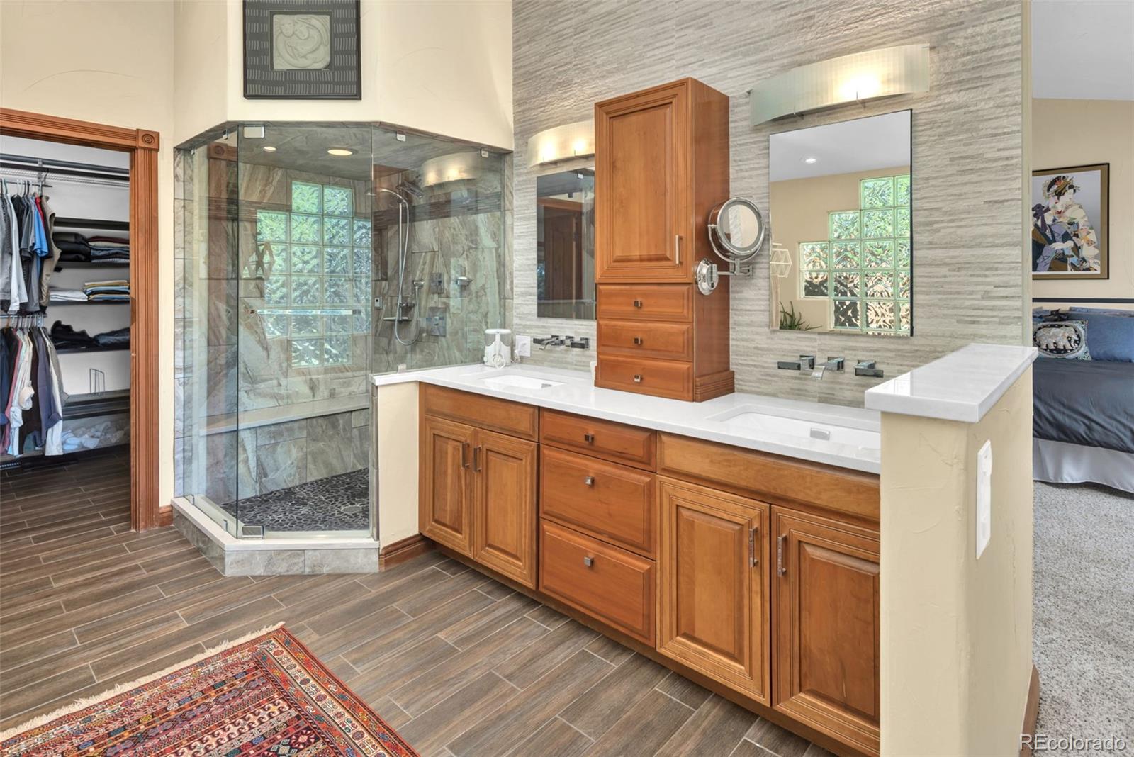 3816 Cloverleaf Drive Boulder, CO 80304 - Photo 19 of 35 a spacious bathroom with double vanity and a mirror