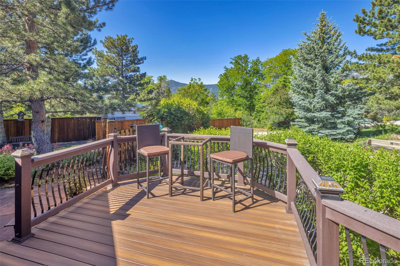 3816 Cloverleaf Drive Boulder, CO 80304 - Photo 4 of 35 a view of a chairs on deck with wooden floor and fence