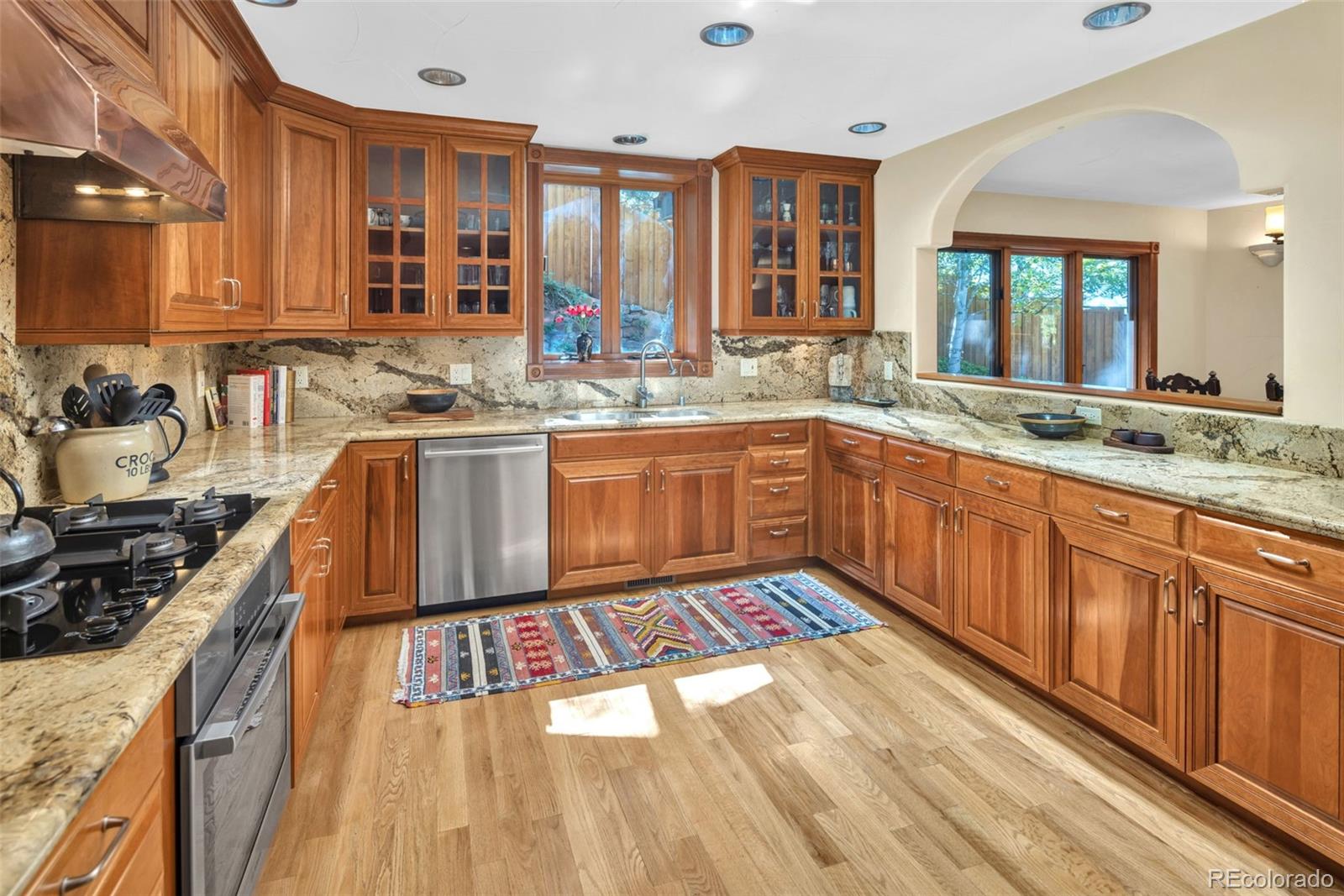 3816 Cloverleaf Drive Boulder, CO 80304 - Photo 10 of 35 a kitchen with stainless steel appliances granite countertop a sink stove and cabinets