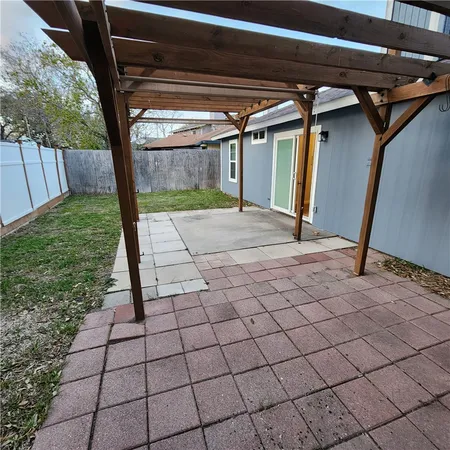 a view of a backyard of the house