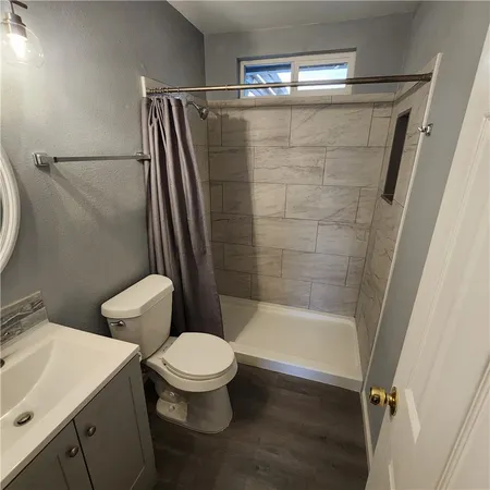 a kitchen with stainless steel appliances granite countertop a stove top oven a sink and a fireplace