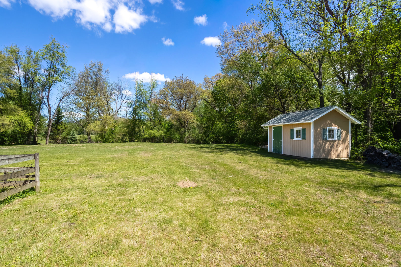 2660 252nd Street De Witt, IA 52742 - Photo 11 of 45 a front view of a house with garden