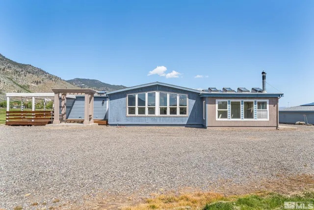 a view of a brick house with a large window