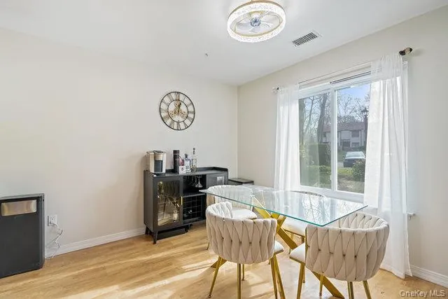 a view of a dining room with furniture window and outside view