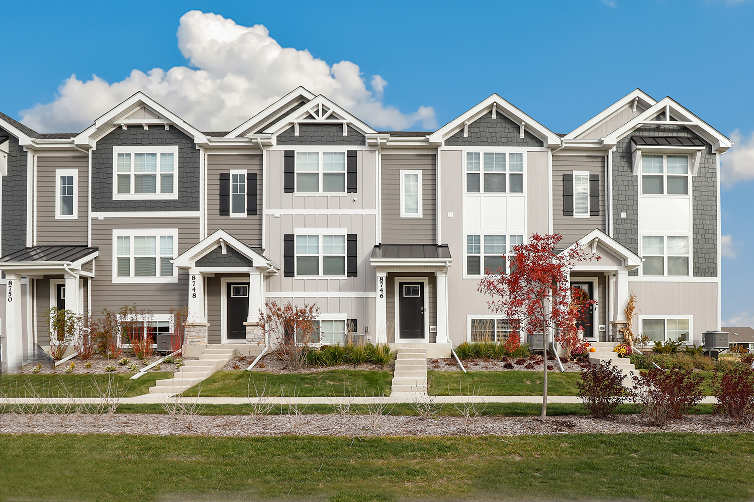 a front view of a house with a yard