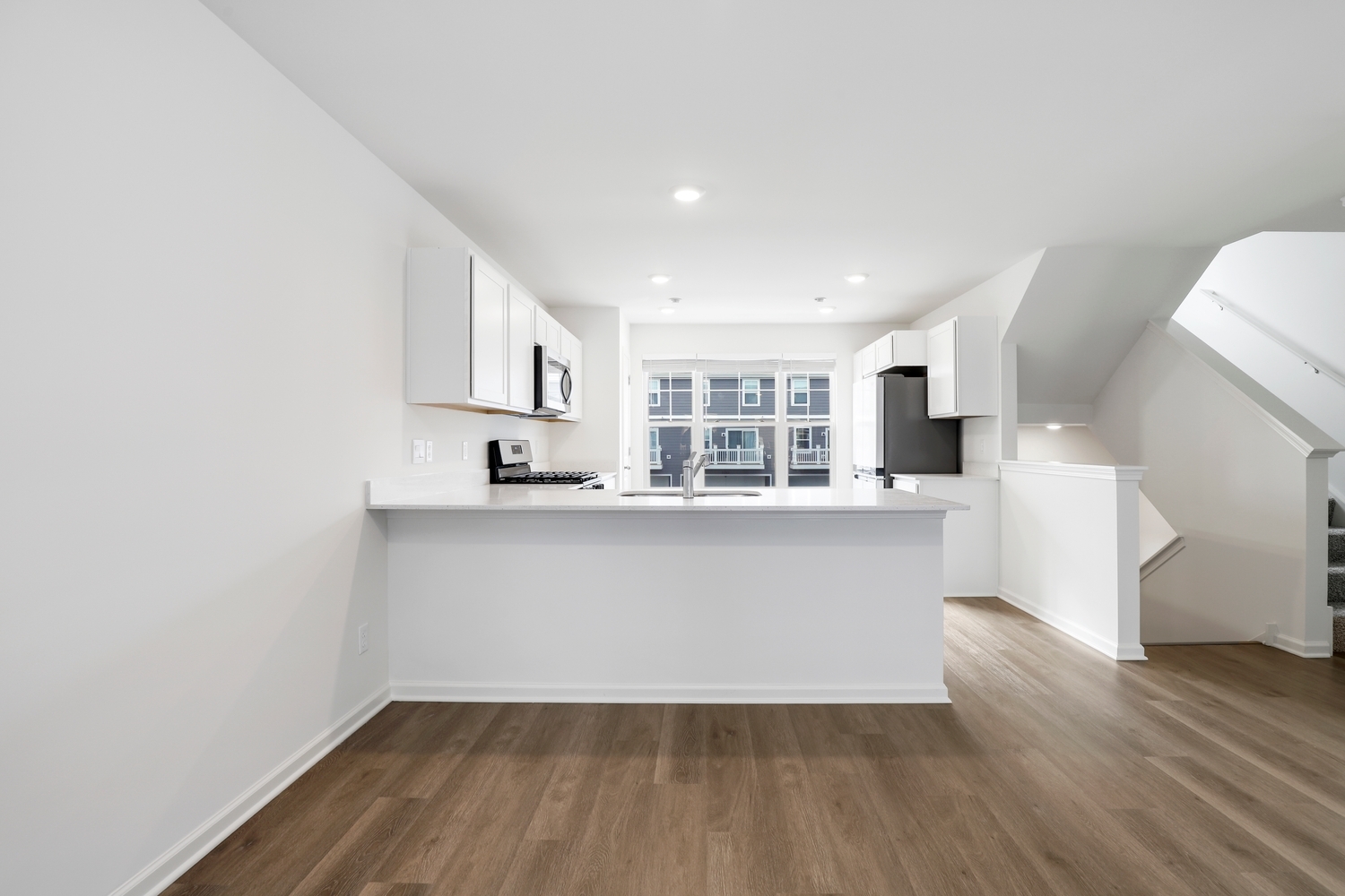 8746 Clover Lane St. John, IN 46373 - Photo 11 of 31 a view of kitchen with wooden floor and electronic appliances