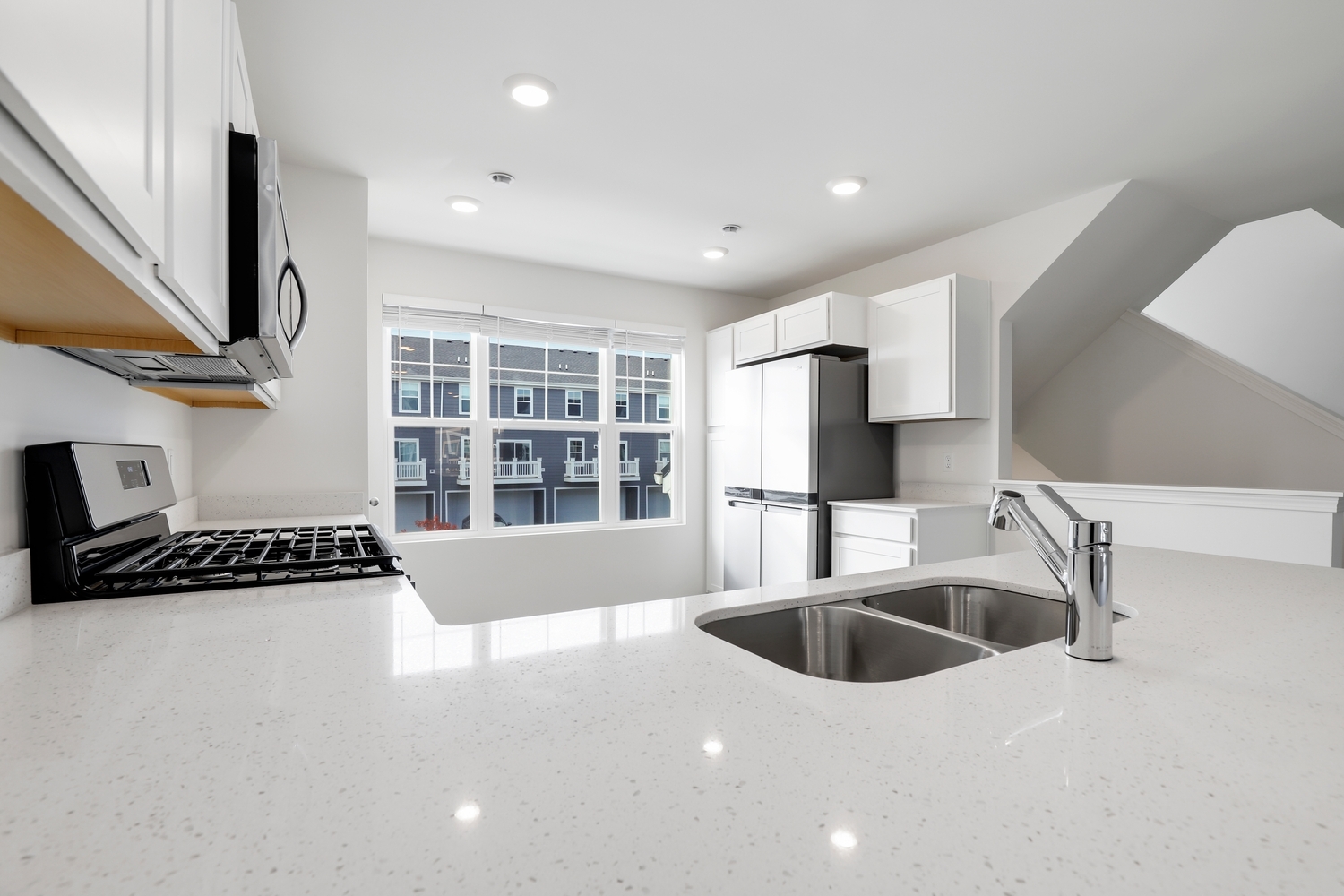 8746 Clover Lane St. John, IN 46373 - Photo 14 of 31 a kitchen with a sink a counter and cabinets
