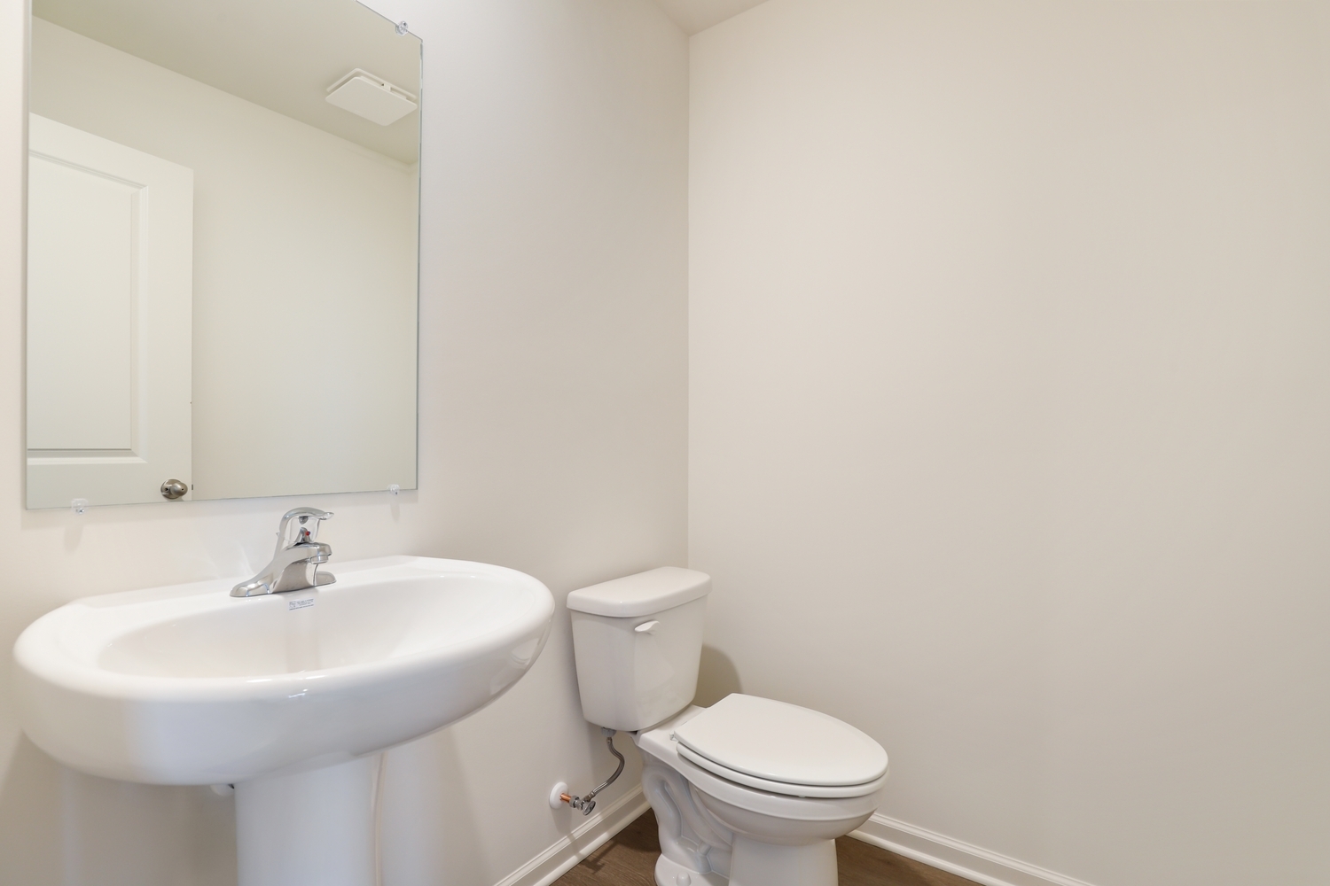 8746 Clover Lane St. John, IN 46373 - Photo 16 of 31 a bathroom with a sink a toilet and a mirror