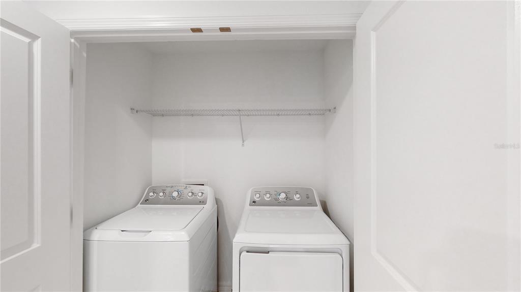 2415 Paravane Way Wesley Chapel, FL 33543 - Photo 13 of 23 a utility room with dryer and washer